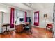 Bright office with hardwood floors, natural light, a desk, and an accent chair with red accents at 218 5Th Se St, Hickory, NC 28602