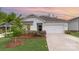 Charming home with a two-car garage, lovely landscaping, and a manicured lawn at 2202 Cherrybark Ct, Denver, NC 28037