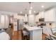 Bright, modern kitchen with stainless steel appliances, a spacious island, and pendant lighting at 2202 Cherrybark Ct, Denver, NC 28037