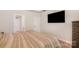 Spacious main bedroom featuring soft neutral paint, recessed lighting, ceiling detail, and tv at 2202 Cherrybark Ct, Denver, NC 28037