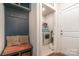 Mudroom features a coat rack, storage bench, and a washer and dryer at 2202 Cherrybark Ct, Denver, NC 28037