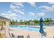 Community pool featuring lounge chairs and a blue umbrella at 2202 Cherrybark Ct, Denver, NC 28037
