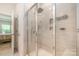 Contemporary shower features a glass door, tile walls, rainfall shower head and built-in niche at 2202 Cherrybark Ct, Denver, NC 28037