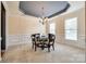 Formal dining room featuring a chandelier and wainscoting at 2235 Legacy Oak Dr, Waxhaw, NC 28173