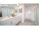 Modern bathroom featuring double sinks, sleek cabinetry and a walk in shower at 3018 Sassafras Trl, Gastonia, NC 28056