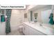 Modern bathroom featuring double sinks, white cabinetry and a shower and tub combination at 3018 Sassafras Trl, Gastonia, NC 28056