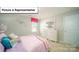 A cozy bedroom with a rainbow themed decor, carpet flooring, and natural light at 3018 Sassafras Trl, Gastonia, NC 28056