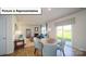Cozy dining area adjacent to living room and glass door leading to backyard at 3018 Sassafras Trl, Gastonia, NC 28056