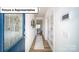 Inviting hallway with wood floors and a decorative front door that leads to other areas of the house at 3018 Sassafras Trl, Gastonia, NC 28056