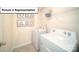 Well-equipped laundry room with modern washer and dryer, plus convenient shelving for storage at 3018 Sassafras Trl, Gastonia, NC 28056