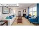 Bright living room features a fireplace, large windows, and coordinated blue accents at 3018 Sassafras Trl, Gastonia, NC 28056