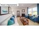 Bright living room features a fireplace, large windows, and coordinated blue accents at 3018 Sassafras Trl, Gastonia, NC 28056