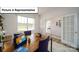 Bright and comfortable home office with a wooden desk, offering an ideal space for remote work at 3018 Sassafras Trl, Gastonia, NC 28056