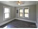 Bedroom featuring a ceiling fan and multiple windows with blinds at 303 Nc Hwy 200 N Hwy, Stanfield, NC 28163