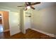 Bedroom featuring a ceiling fan, closet and hardwood floors at 303 Nc Hwy 200 N Hwy, Stanfield, NC 28163