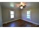 Cozy bedroom with hardwood floors, neutral walls, and natural light at 303 Nc Hwy 200 N Hwy, Stanfield, NC 28163