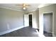 Bedroom featuring a ceiling fan, closet and updated flooring at 303 Nc Hwy 200 N Hwy, Stanfield, NC 28163