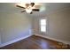 Bedroom featuring hardwood floors, ceiling fan, and natural light from the window at 303 Nc Hwy 200 N Hwy, Stanfield, NC 28163