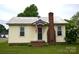 Charming one-story home with a brick chimney, a brick staircase, and a tidy front yard at 303 Nc Hwy 200 N Hwy, Stanfield, NC 28163