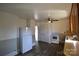 The kitchen features neutral walls, hardwood floors and classic appliances at 303 Nc Hwy 200 N Hwy, Stanfield, NC 28163