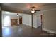 Open living room with hardwood floors and a brick fireplace at 303 Nc Hwy 200 N Hwy, Stanfield, NC 28163