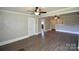 Open living room with hardwood floors, updated lighting and neutral paint at 303 Nc Hwy 200 N Hwy, Stanfield, NC 28163