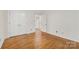 Bedroom with hardwood floors, a double door closet and two points of entry at 310 Whitestone Rd, Charlotte, NC 28270