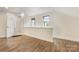 Upstairs bonus room features laminate flooring and access to an en suite bathroom at 310 Whitestone Rd, Charlotte, NC 28270