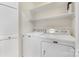 Laundry room with a white washer and dryer and white cabinets at 310 Whitestone Rd, Charlotte, NC 28270