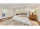 Spacious main bedroom features hardwood floors, neutral paint, and a large window at 310 Whitestone Rd, Charlotte, NC 28270