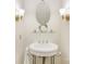 Stylish powder room features a pedestal sink and modern lighting at 310 Whitestone Rd, Charlotte, NC 28270