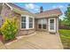 Back patio with direct access to a brick home that has a bay window at 3327 Flagler Cir, Midland, NC 28107