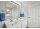 Double vanity bathroom showcasing a large mirror, white cabinets, and modern fixtures at 3327 Flagler Cir, Midland, NC 28107