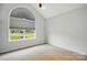 Bright room with a large window, a vaulted ceiling, and neutral carpet flooring at 3327 Flagler Cir, Midland, NC 28107