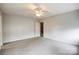 The bright bedroom features neutral walls, carpet flooring, and a view to the stairs at 3327 Flagler Cir, Midland, NC 28107