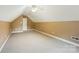 Carpeted bonus room features neutral tones, a ceiling fan, and ample open space at 3327 Flagler Cir, Midland, NC 28107