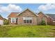 Charming brick home with large windows and a well-manicured lawn in a residential neighborhood at 3327 Flagler Cir, Midland, NC 28107