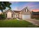 Charming brick home with manicured lawn, attached two-car garage, and welcoming front porch at 3327 Flagler Cir, Midland, NC 28107