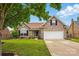 Well-maintained brick home with mature trees, a two-car garage, and a landscaped front yard at 3327 Flagler Cir, Midland, NC 28107
