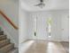 Bright foyer featuring tile flooring, a staircase with wooden banister, and natural light at 3327 Flagler Cir, Midland, NC 28107