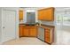 Efficient kitchen features a double sink, wooden cabinets, and a stainless steel dishwasher, perfect for daily use at 3327 Flagler Cir, Midland, NC 28107