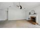 Neutral living room with carpet, white walls, brick fireplace with mantle, and ceiling fan at 3327 Flagler Cir, Midland, NC 28107