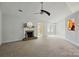 Bright living room featuring carpet, a brick fireplace, and plenty of natural light at 3327 Flagler Cir, Midland, NC 28107