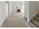 Spacious living room with carpet flooring and white walls, featuring a brick fireplace at 3327 Flagler Cir, Midland, NC 28107