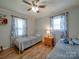 Inviting ' bedroom with two twin beds, colorful curtains, and playful decor for a cheerful vibe at 335 Linda St, Salisbury, NC 28146