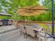 Outdoor deck featuring a patio dining table with chairs and a large umbrella, perfect for enjoying outdoor meals at 335 Linda St, Salisbury, NC 28146