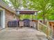 Spacious deck with covered outdoor kitchen area, complete with a grill, furniture, and backyard views at 335 Linda St, Salisbury, NC 28146