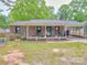 Charming brick home with a covered porch and carport at 335 Linda St, Salisbury, NC 28146
