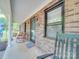 Welcoming brick front porch with rocking chairs offers a relaxing outdoor space and curb appeal at 335 Linda St, Salisbury, NC 28146