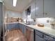 Well-appointed kitchen featuring updated cabinets, a stainless steel dishwasher, and a double sink at 335 Linda St, Salisbury, NC 28146